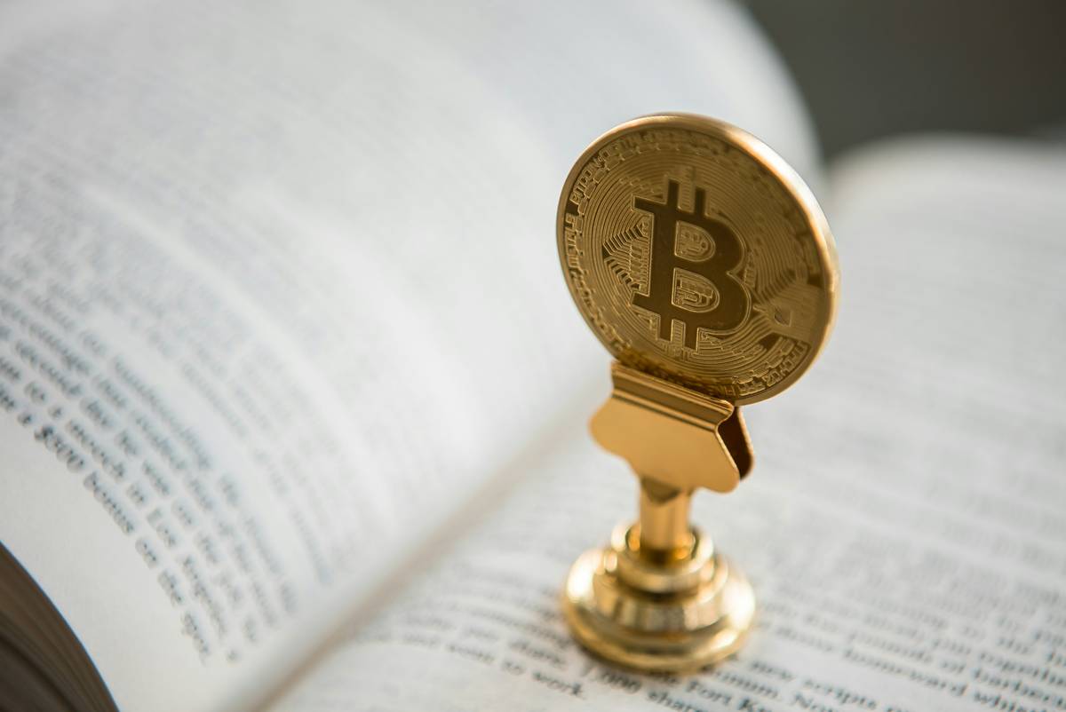 Infographic showing taxable vs non-taxable crypto events: buying crypto with fiat = non-taxable; selling for USD = taxable; swapping BTC for ETH = taxable; receiving staking rewards = taxable; transferring between own wallets = non-taxable.