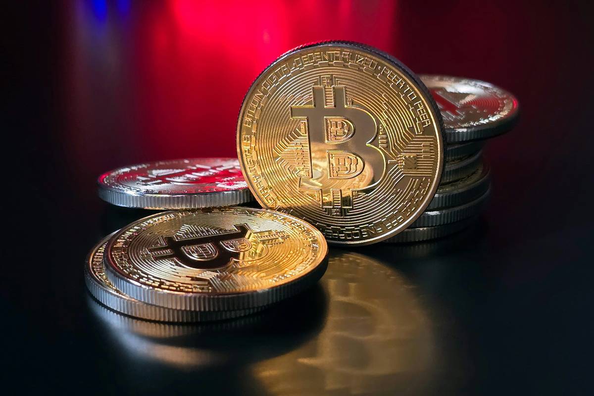 Flowchart showing when crypto transactions are taxable: selling, trading, spending, earning rewards = reportable; buying and holding = not reportable